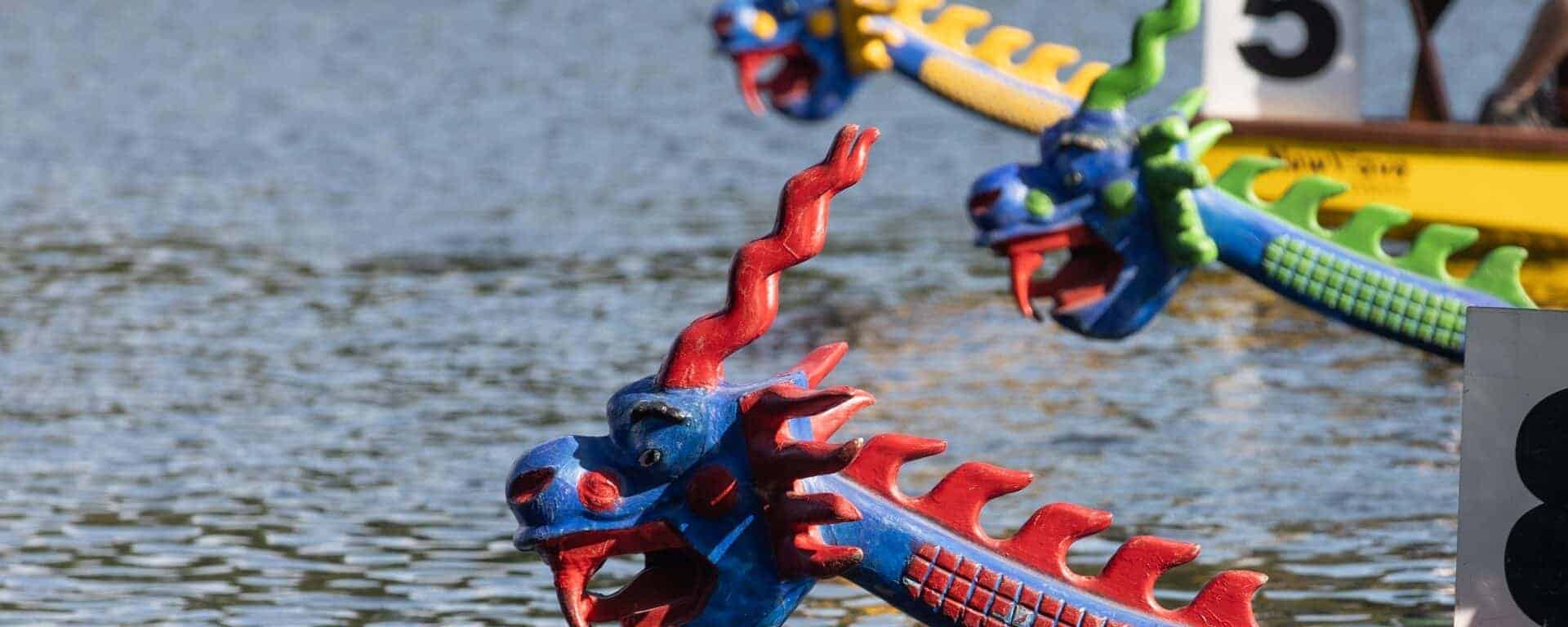 Close up of dragon boats on lake