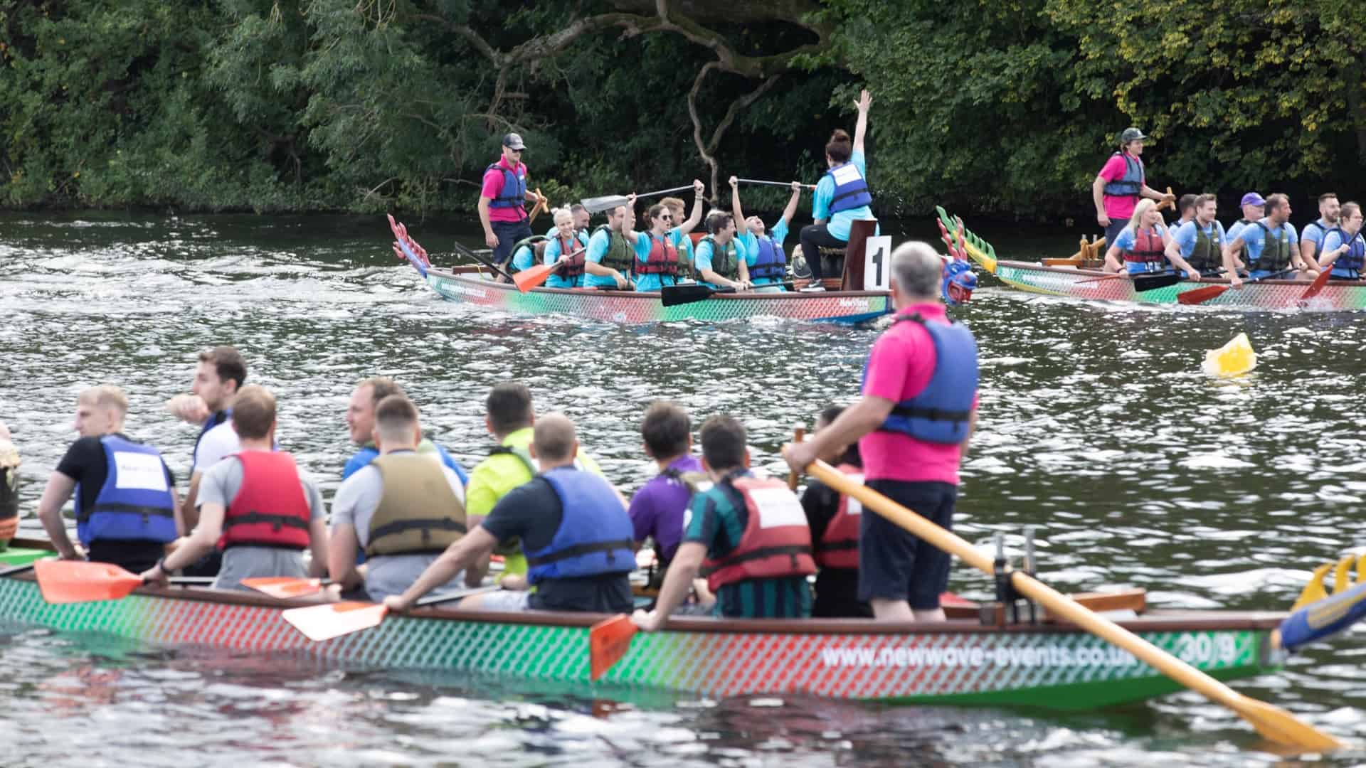 People sailing a boat at dragon boat race.