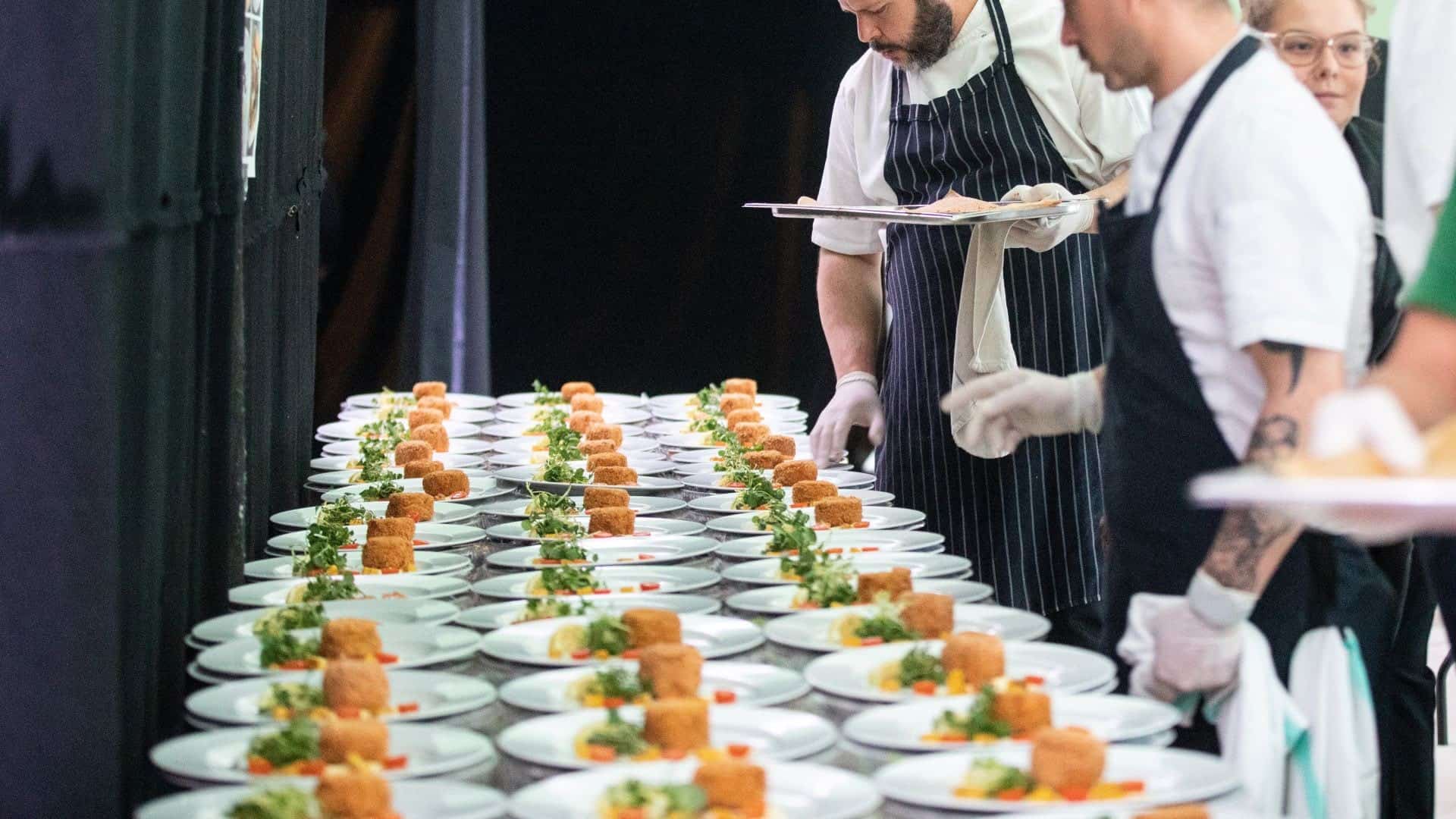 Course of food being plated up at hotel