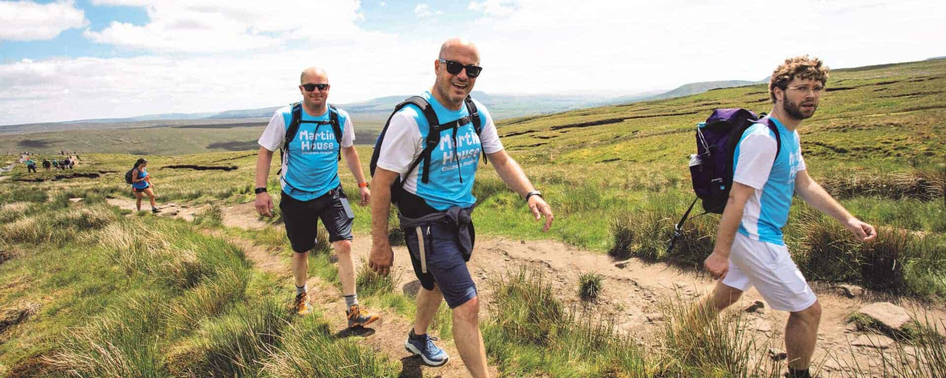 Two men hiking up one of the Yorkshire Three Peaks