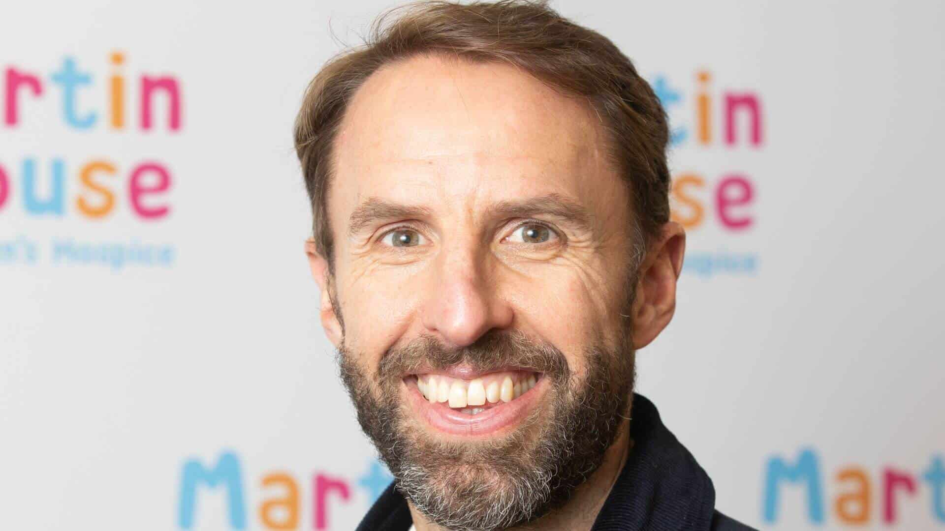 Gareth Southgate in front of Martin House back drop