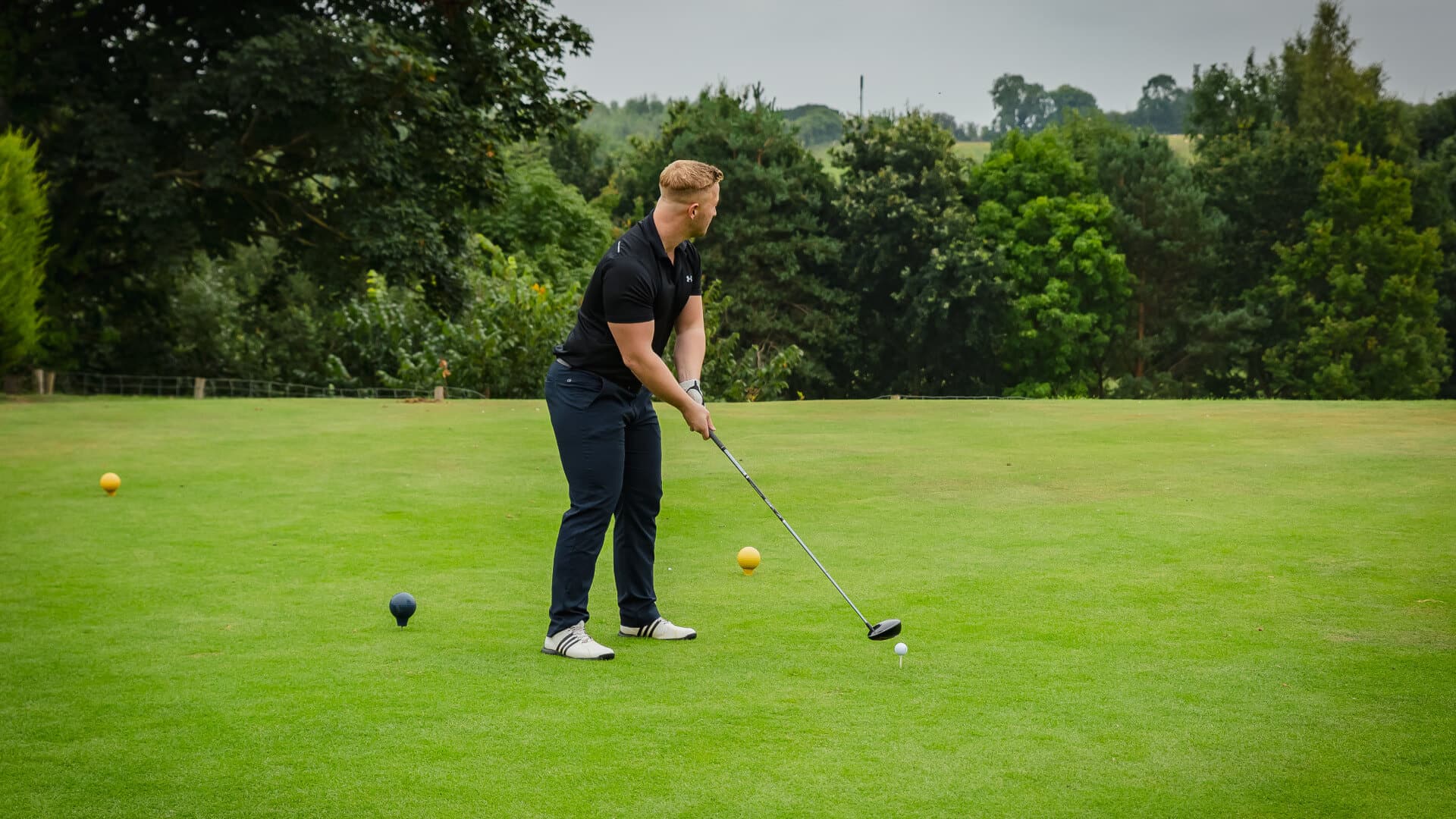 Man taking a golf swing