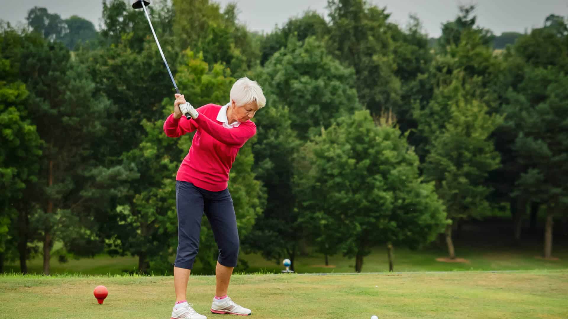 Woman doing a gold swing