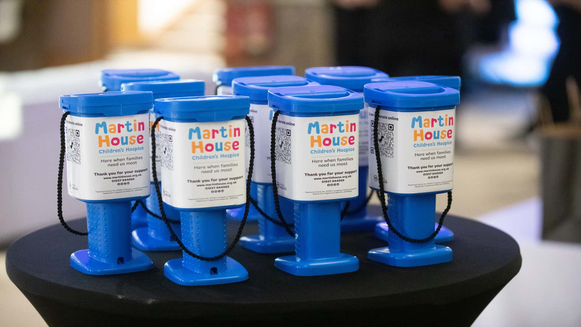 Collection buckets saying Martin House