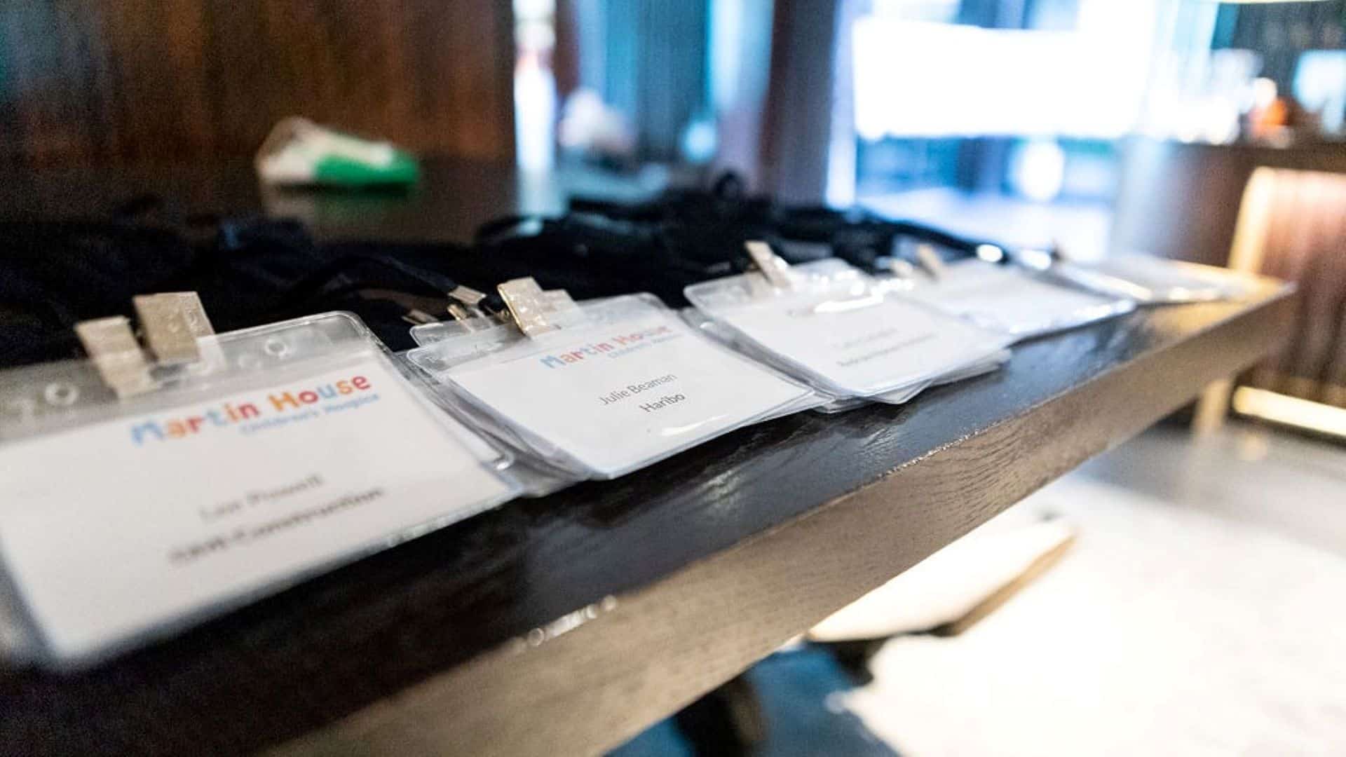 Thanking partners Photo of name badges of partnerships