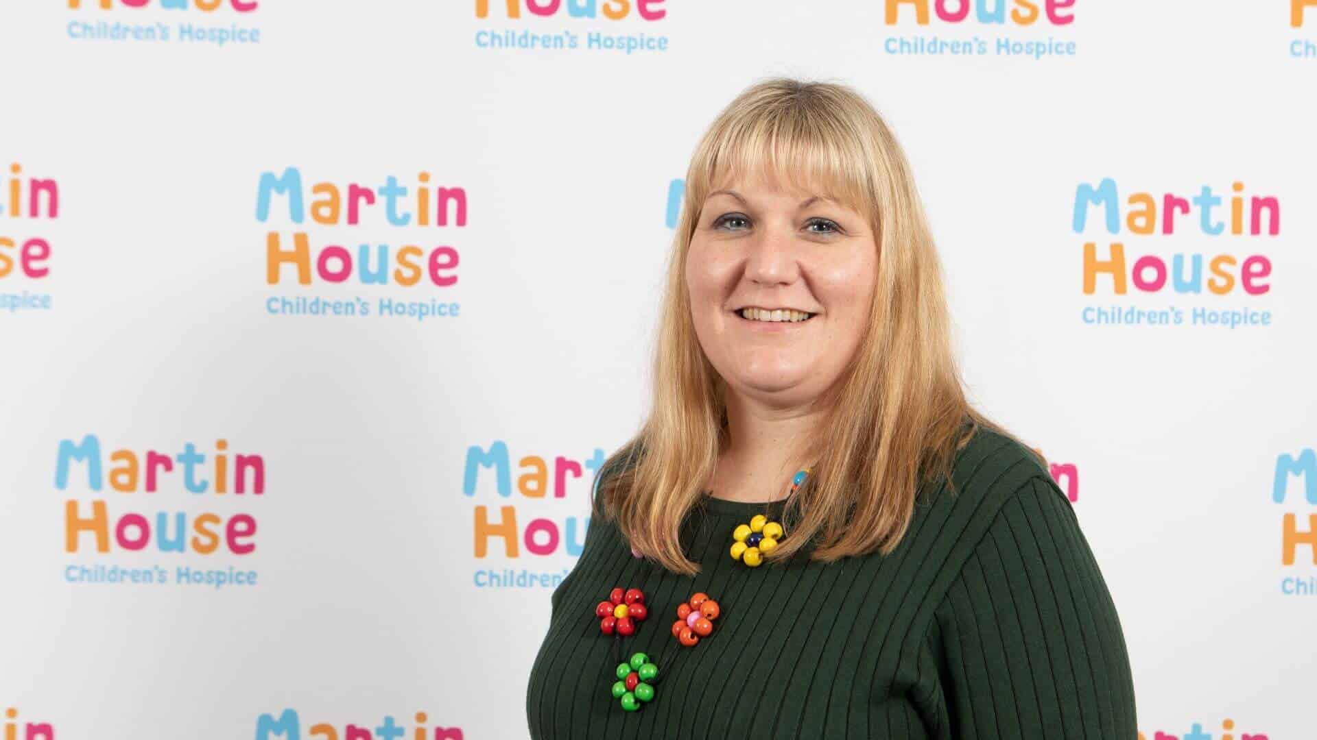 Head shot of Antoinette in front of Martin House back drop.