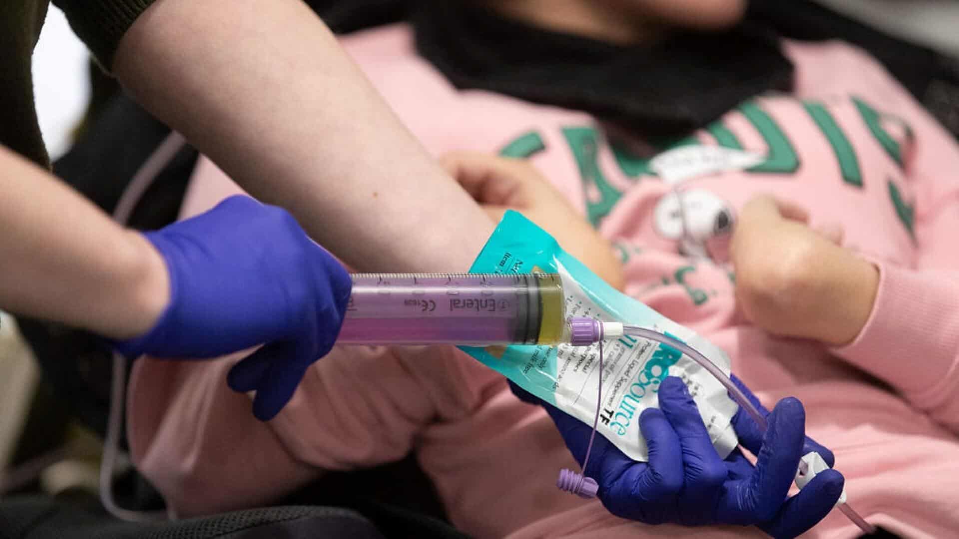 Close up of someone providing medicinal care to a child.