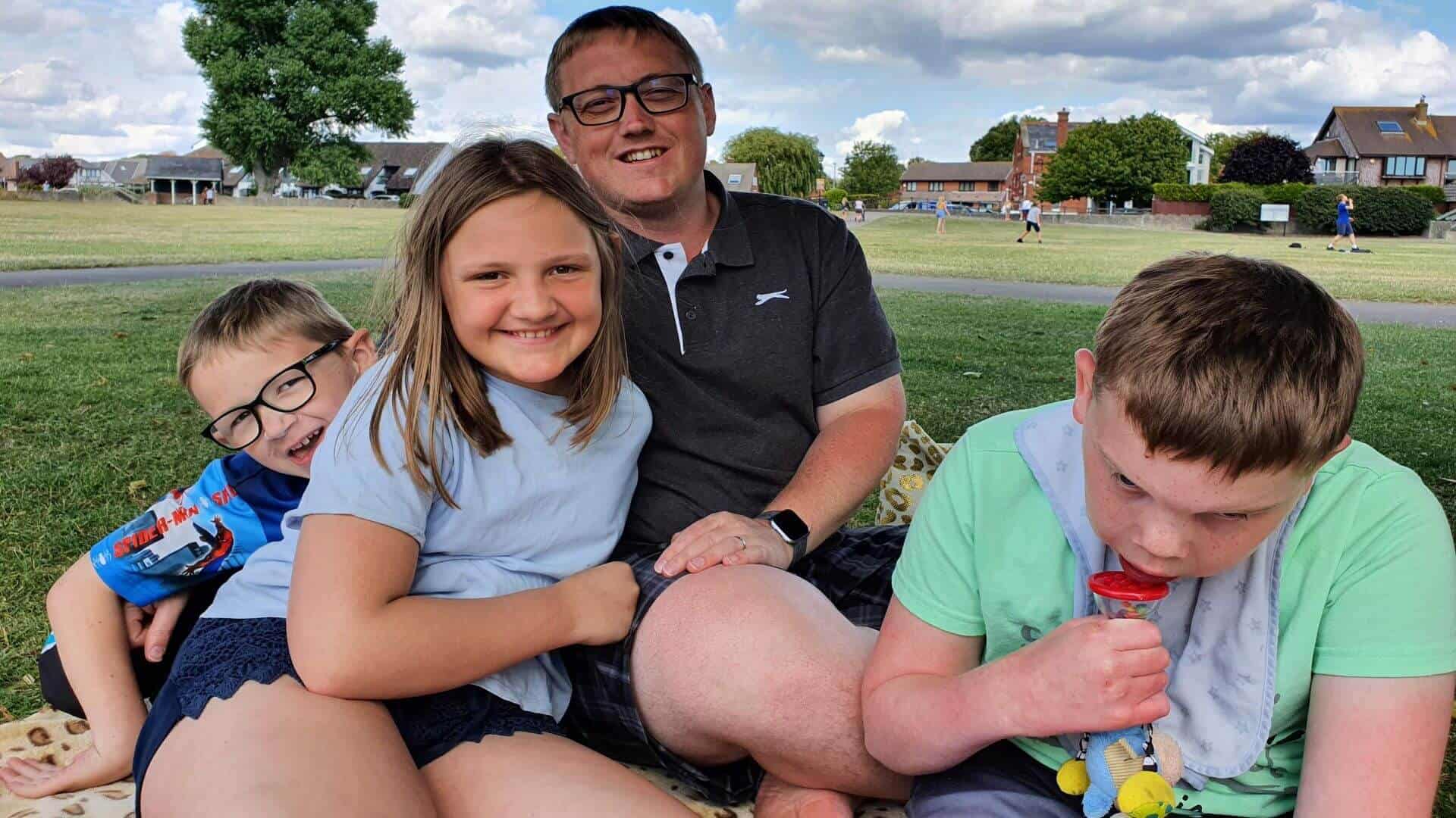 Family sat in field