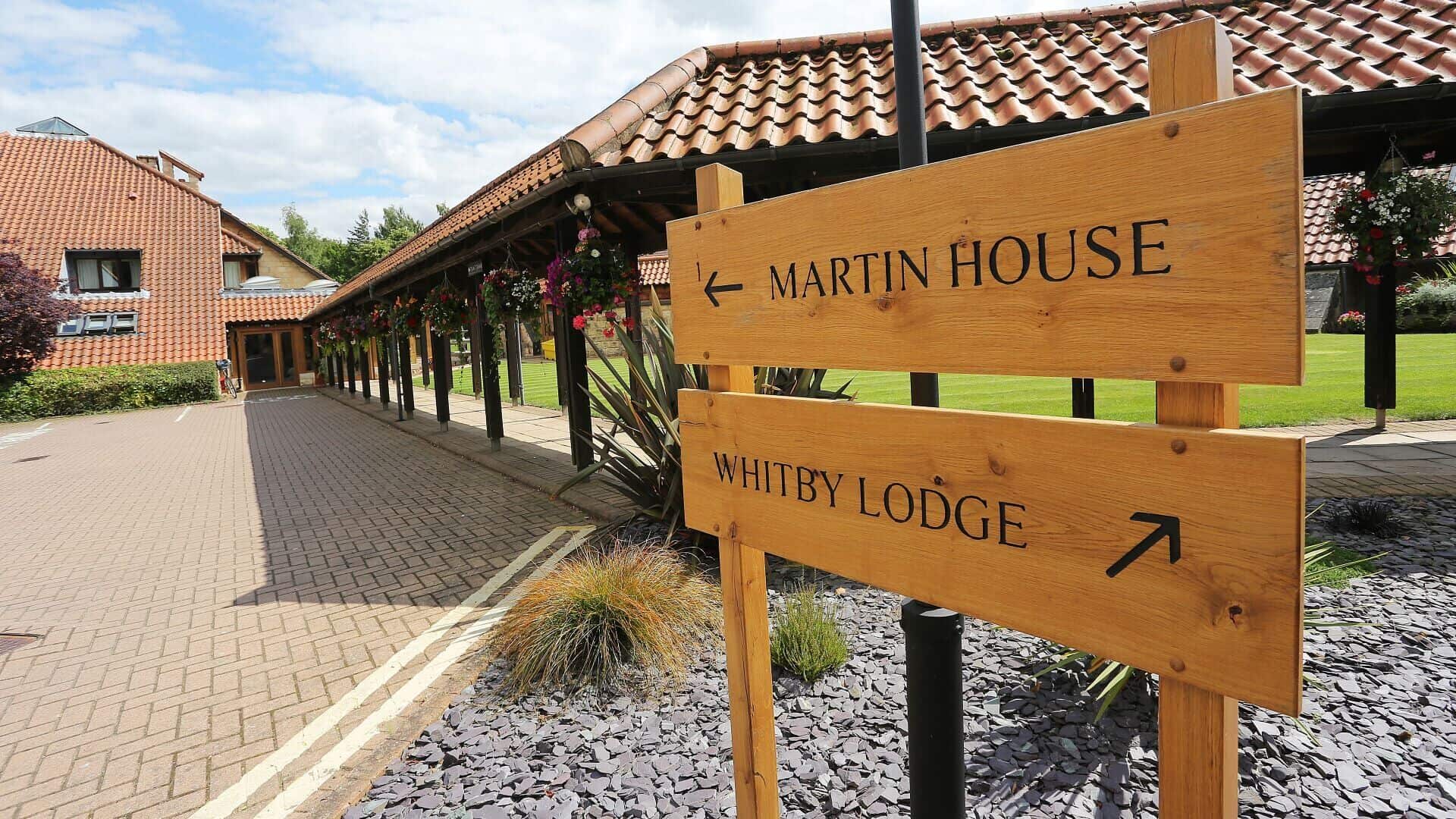 Sign pointing to Martin House and Whitby Lodge