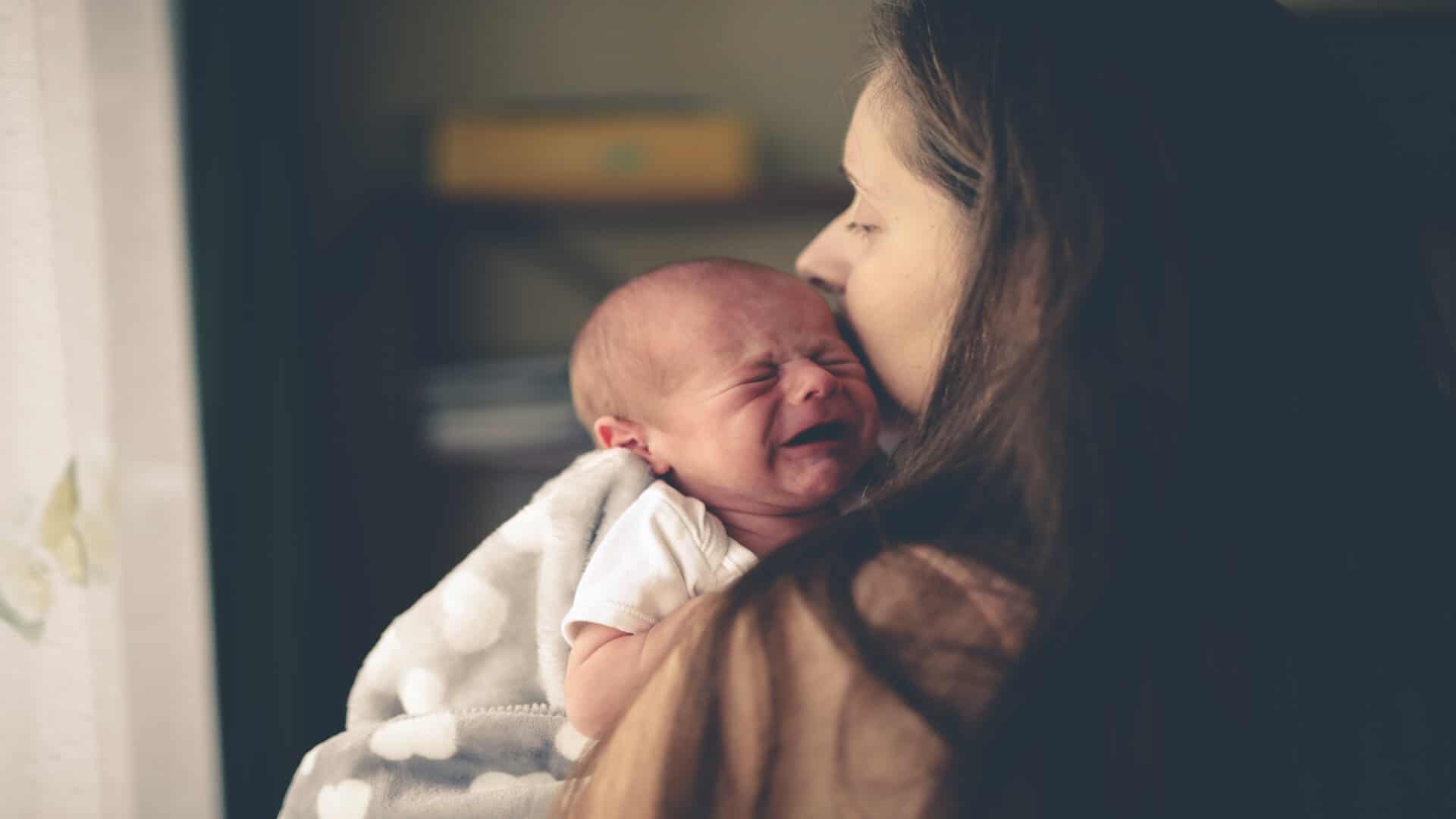 Mum holding a new born baby