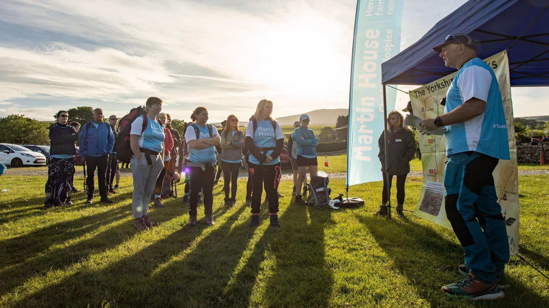 Yorkshire three peaks Group of people gathered in field next to gazebo