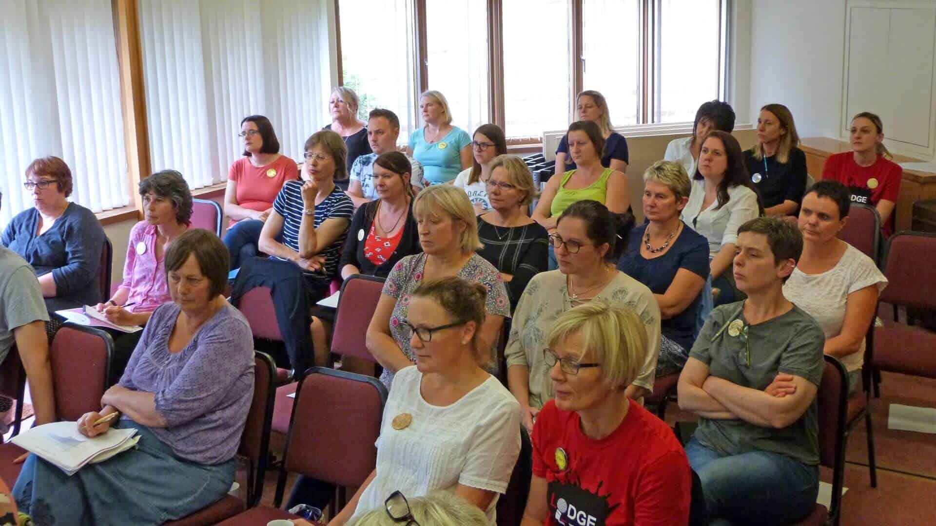 Large group of people at a workshop / presentation