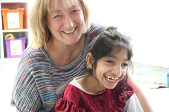 Woman and young girl smiling