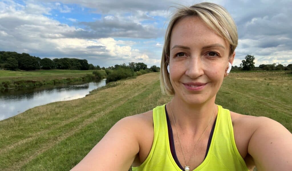 Laura Bell in countryside on run.