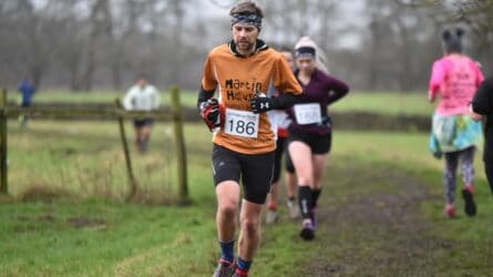 Peter running wearing Martin House t-shirts.
