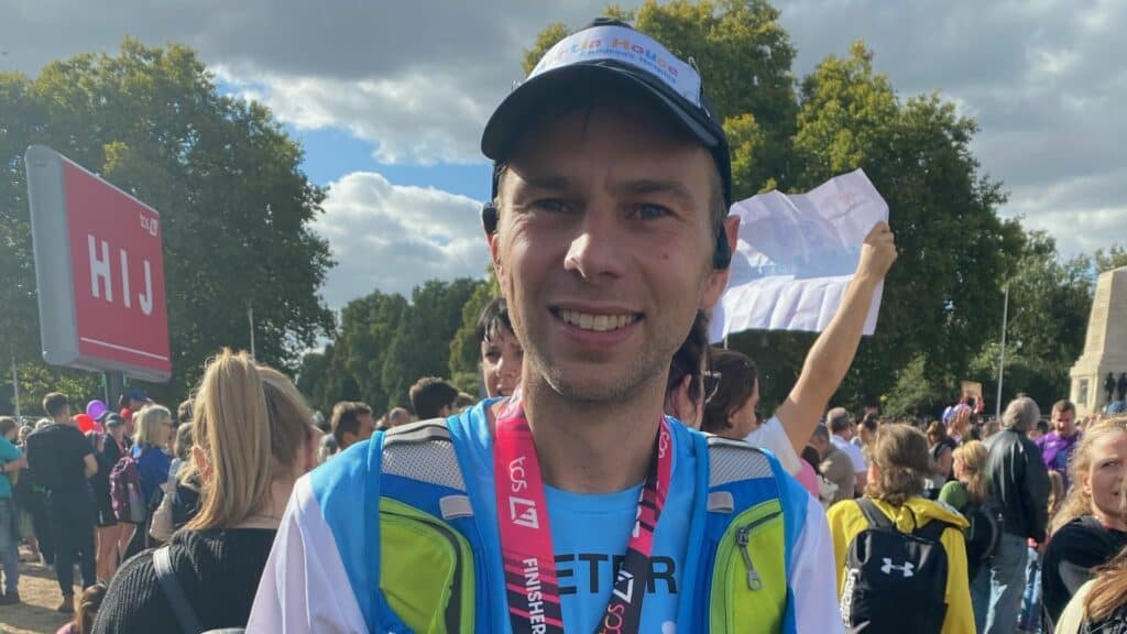 Peter smiling after completing London Marathon.