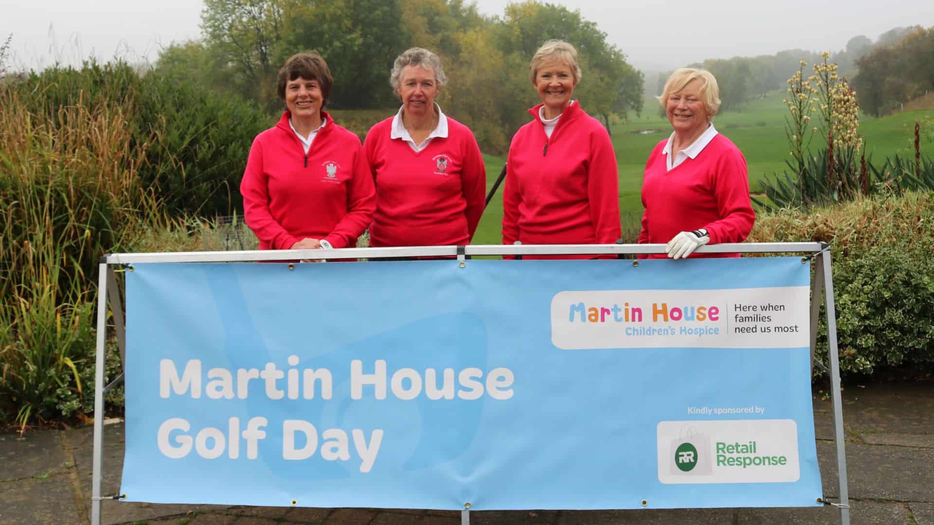 Four women smiling at Martin House Golf Day event.