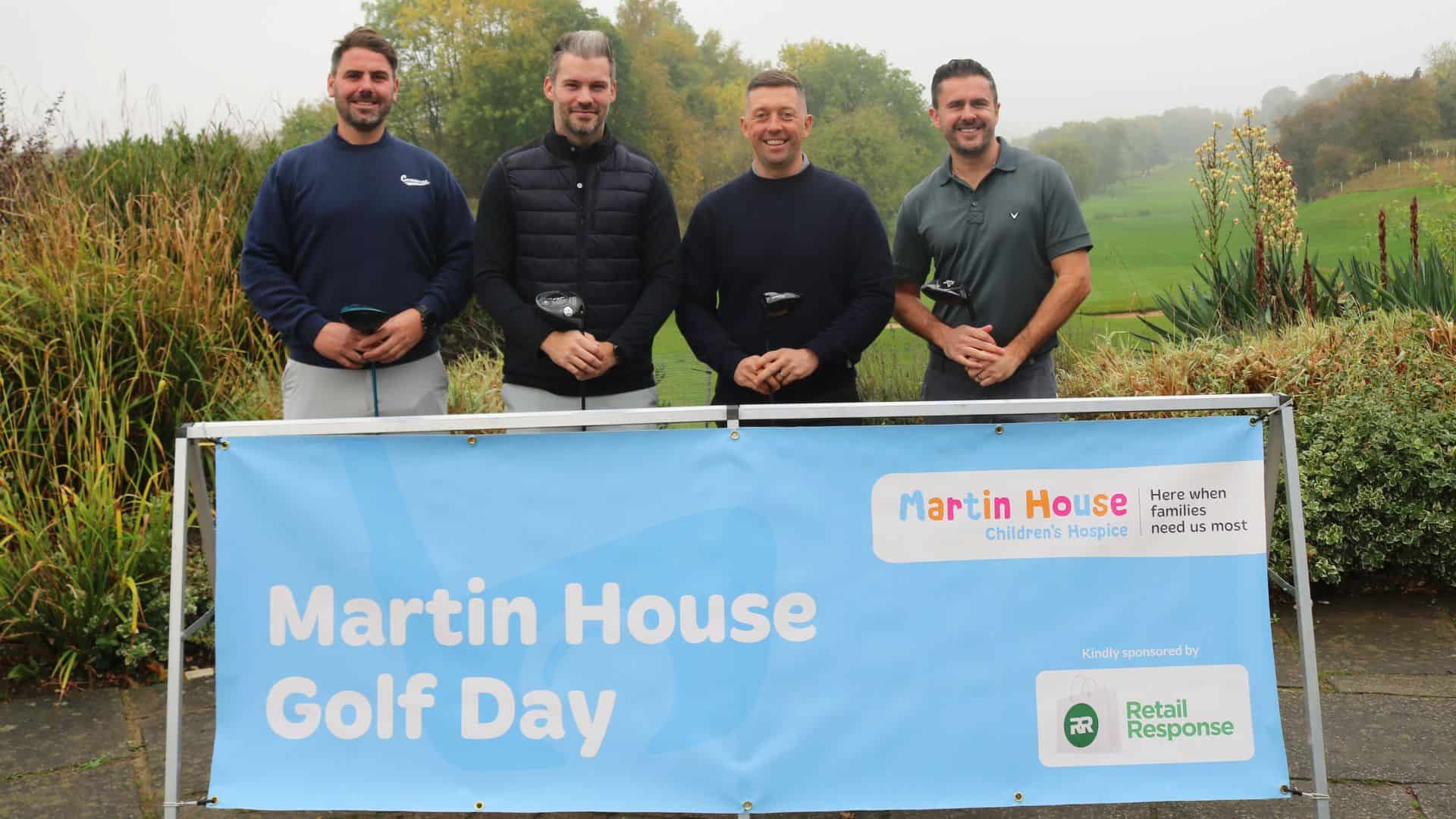 Four men smiling at Martin House Golf Day event.