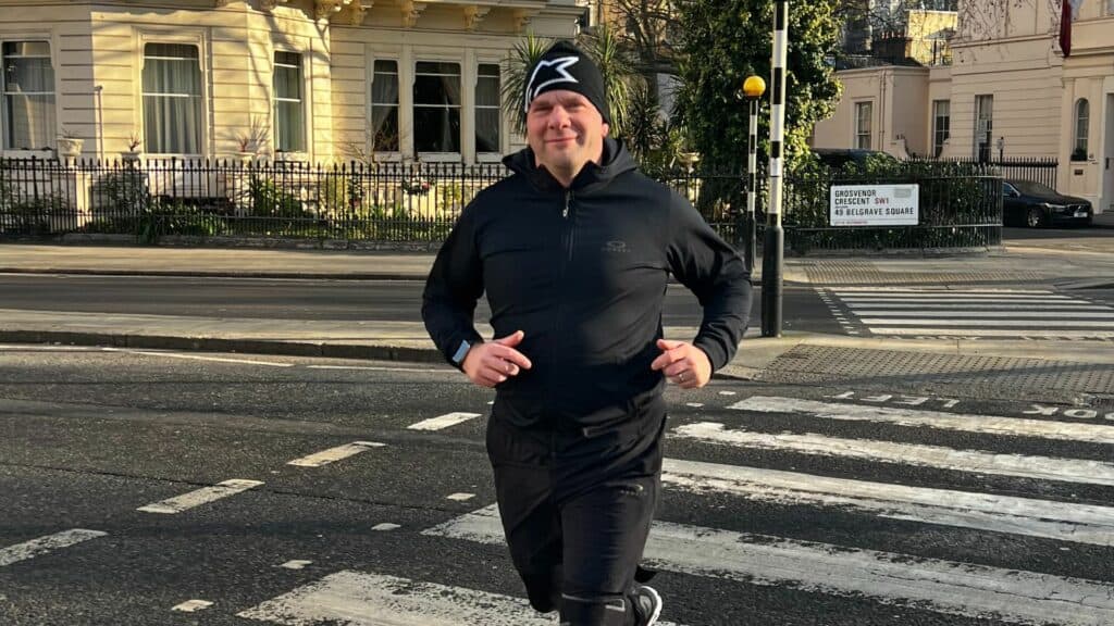 Peter smiling while running.