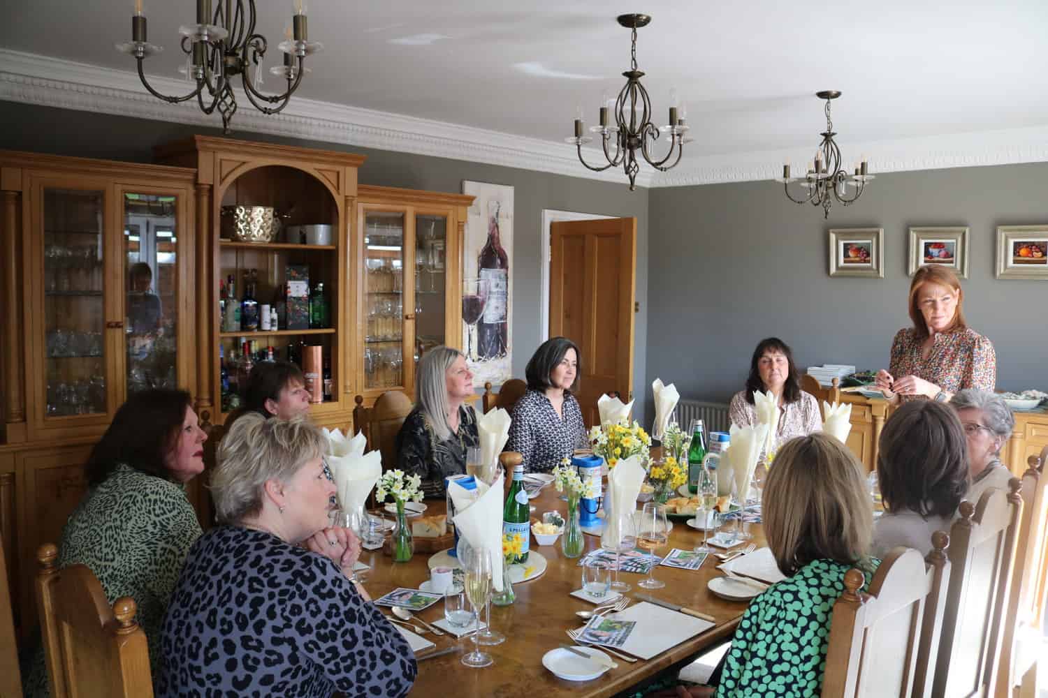 Ladies sat at table in kitchen