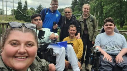 An image showing young people from Martin House and Care Team Members smiling at our annual Calvert Kielder adventure trip.